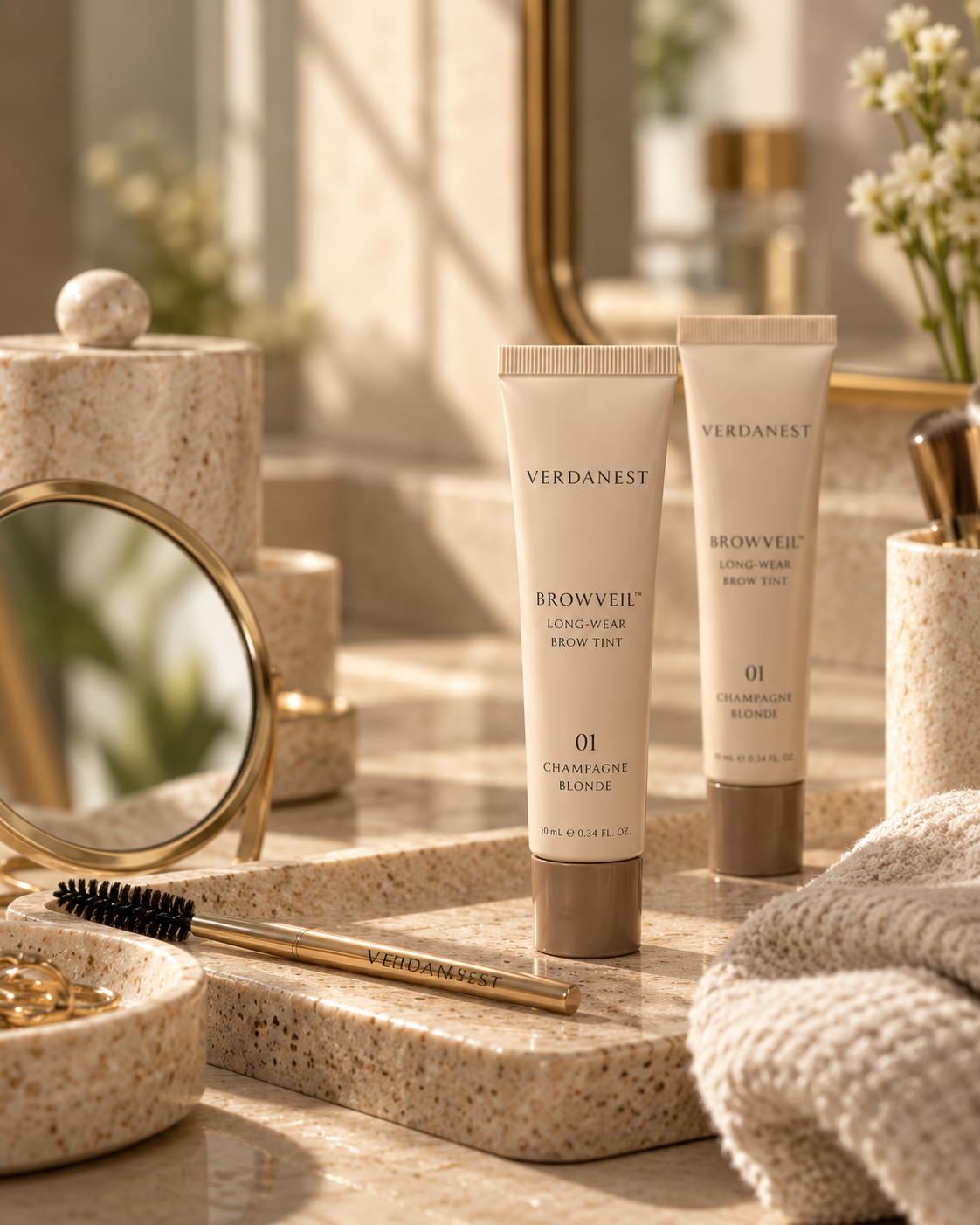 Verdanest BrowVeil on a warm vanity beside a mirror and brow brush